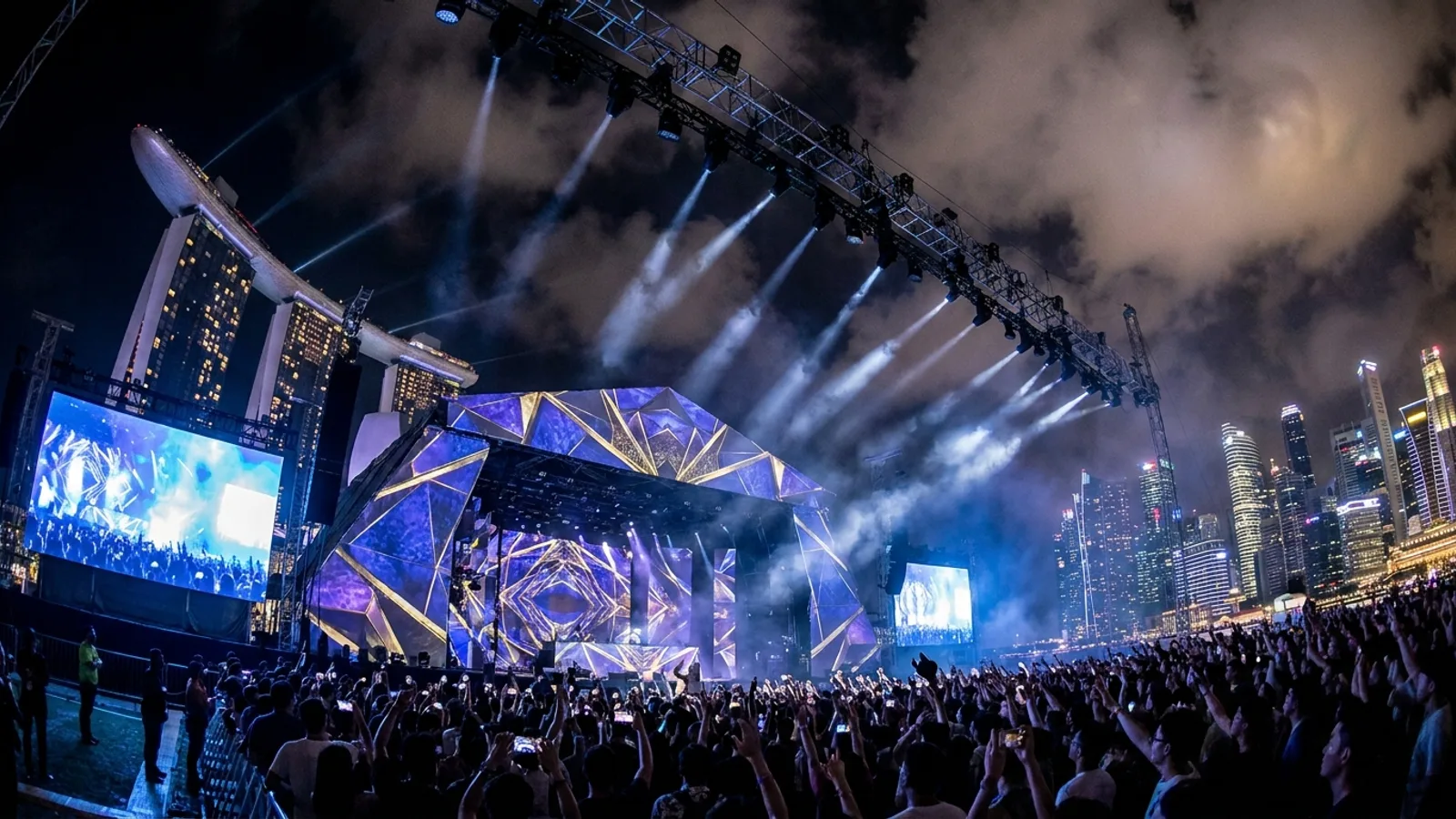 A large-scale event production in Singapore at night with projection mapping, massive LED screens and a stage lighting rig