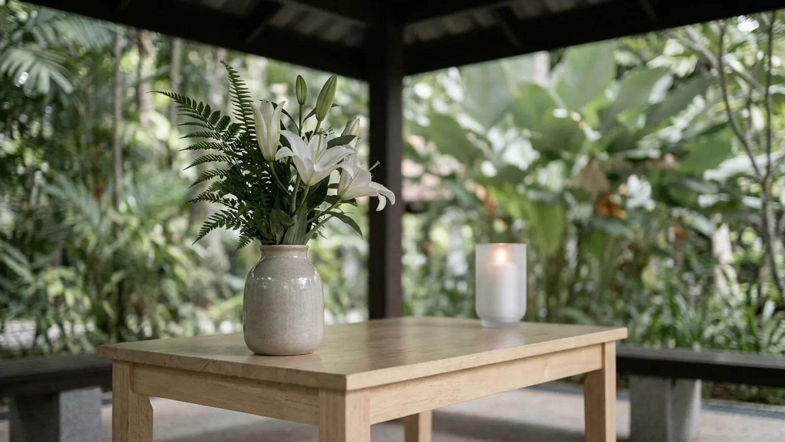 A calm memorial setting in Singapore with white lilies, representing a dignified funeral service