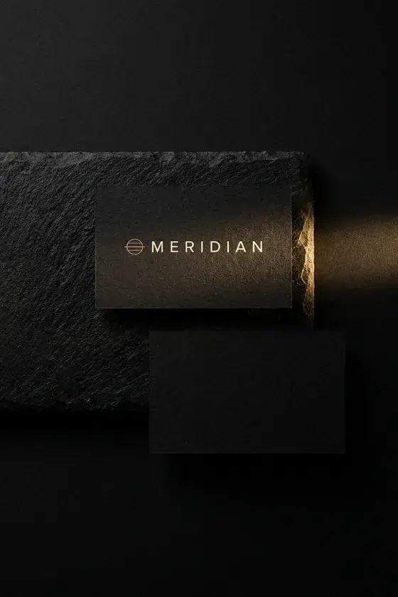 Meridian business card in matte black with a gold foil hairline