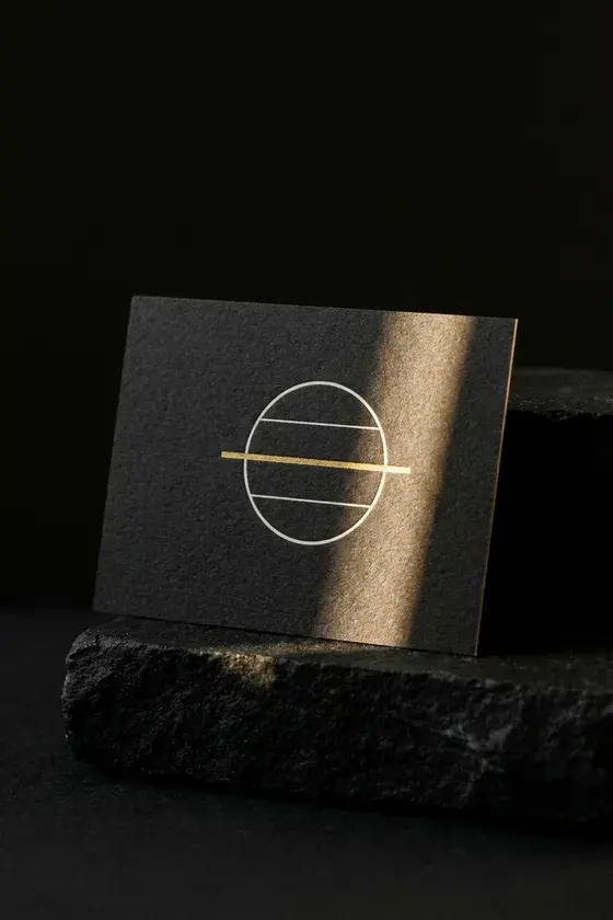 Meridian gift card showing the monogram alone on matte black board
