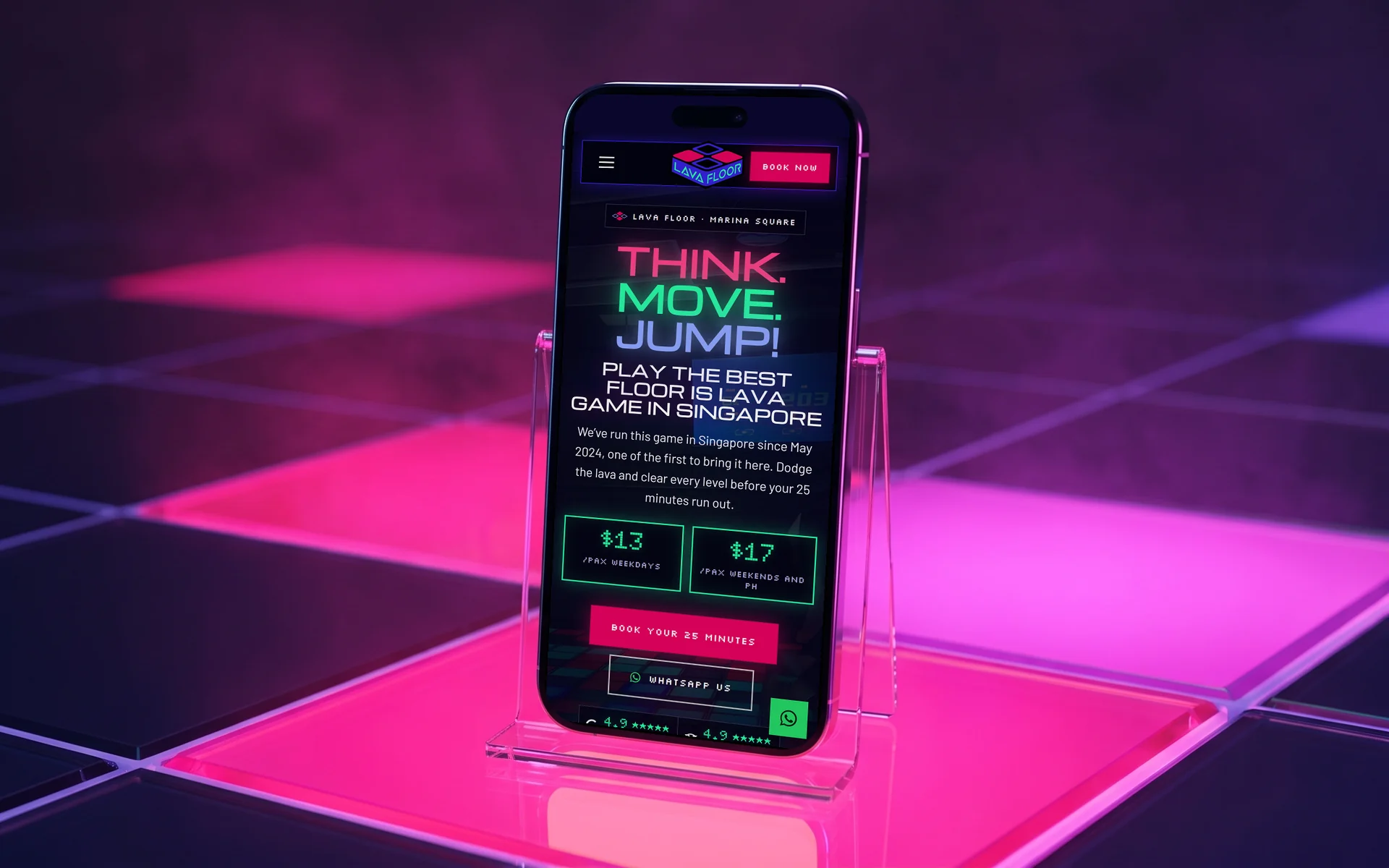 Lava Floor mobile site, "Think. Move. Jump!" in neon above the weekday and weekend prices, on a phone standing on a glowing LED lava floor